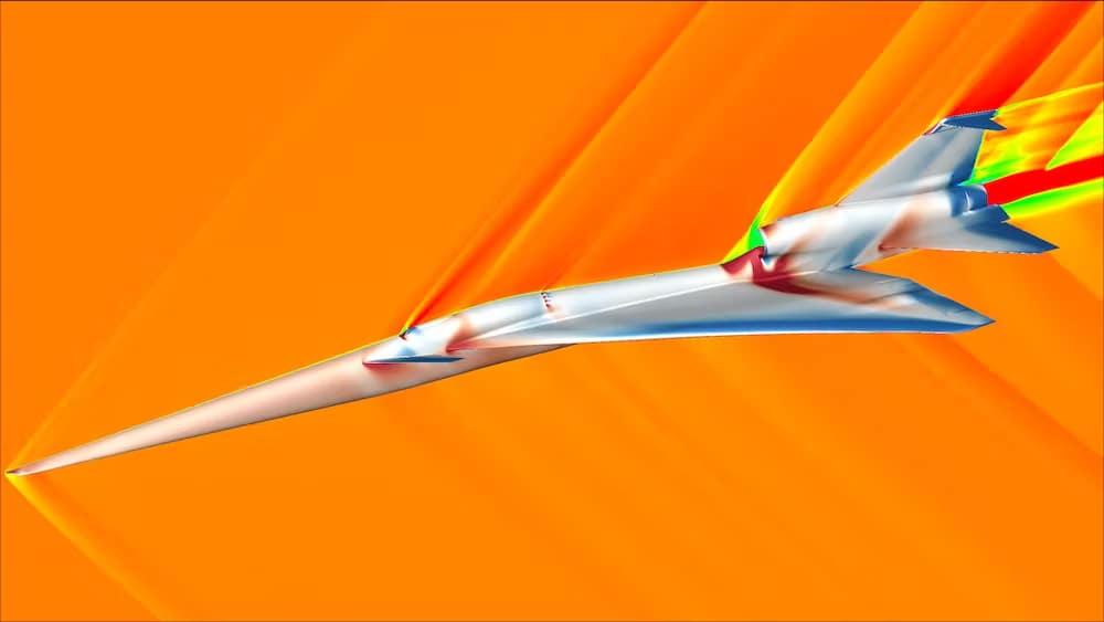 Simulazione fluidodinamica del concetto di velivolo X-59 durante il volo supersonico. I colori mostrati sull'aereo indicano la pressione superficiale, con pressioni inferiori mostrate in blu e pressioni più alte mostrate in rosso. I colori visualizzati nello spazio aereo che circonda l'aeromobile indicano la velocità del flusso d'aria, che va dal blu, che indica velocità zero, a velocità più elevate in rosso