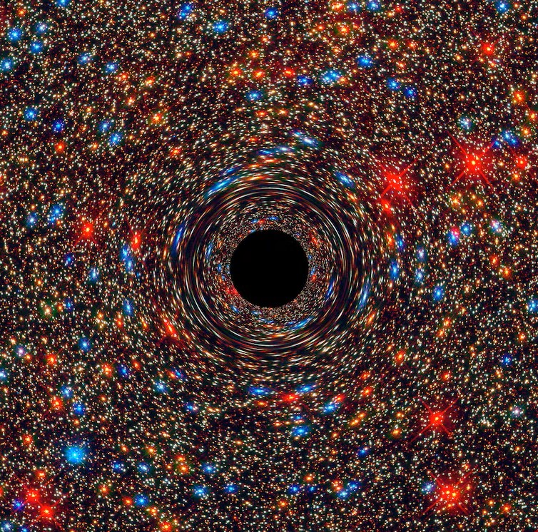immagine simulata al computer di un buco nero supermassiccio al centro di una galassia
